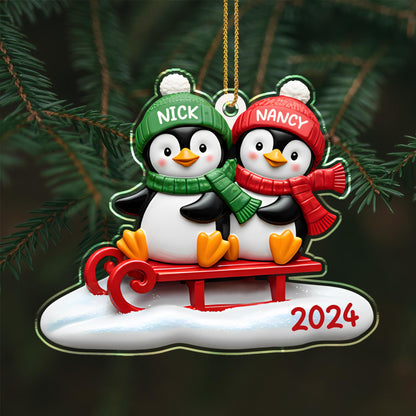 Waddle Into The Holiday Spirit Together With Penguins On A Sled