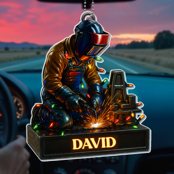 Skilled Welder At Work With Festive Lights