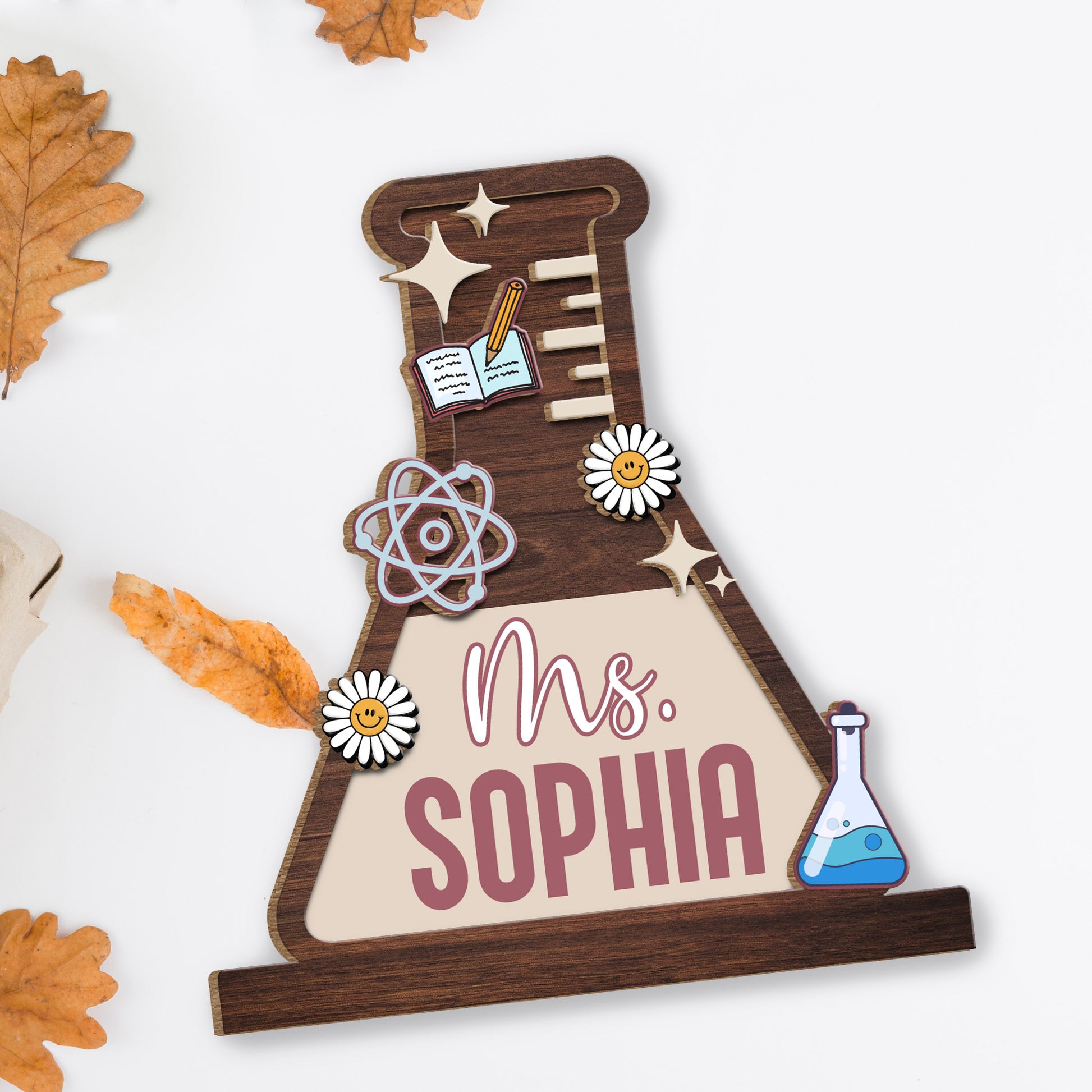 Celebrate Knowledge With Daisies, Atom Model, Notebook, and Beaker